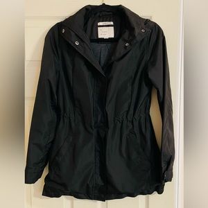A New Day black zip up rain jacket with hood and cinch waist.